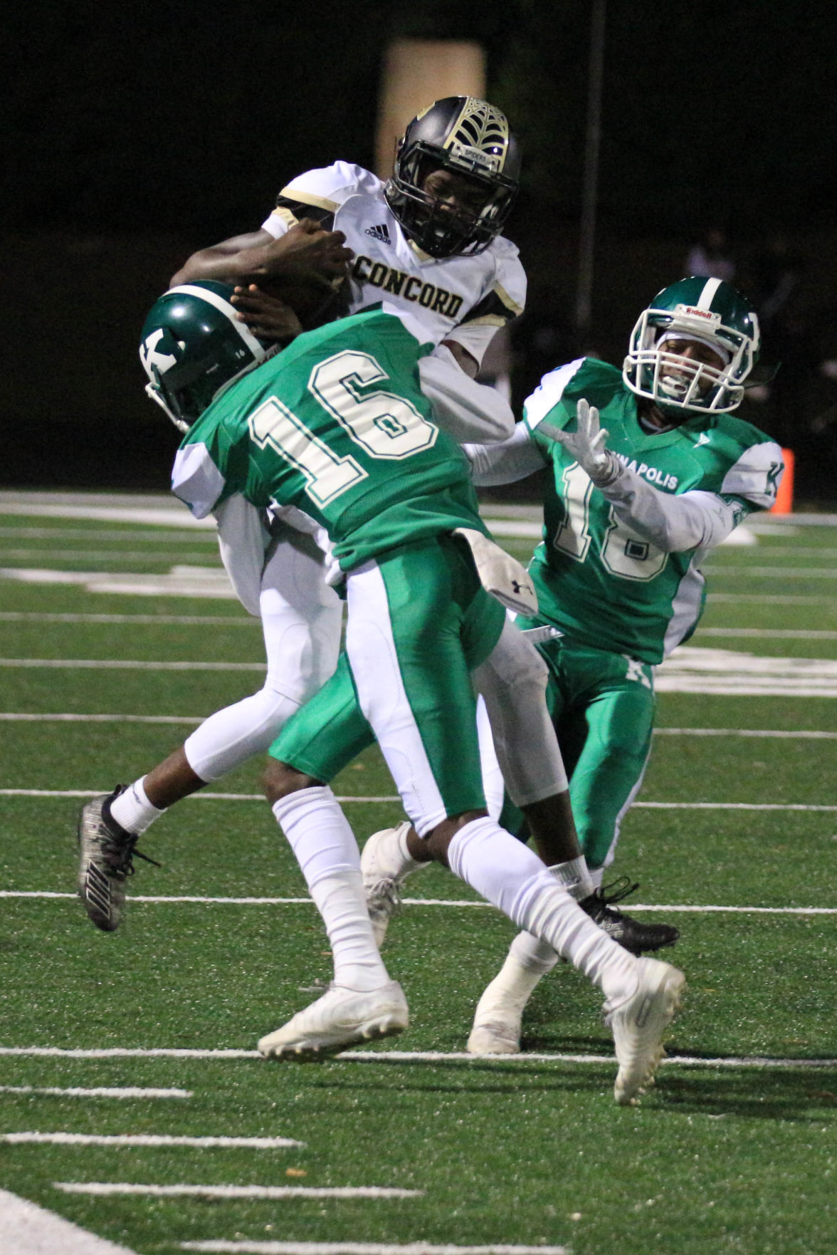 ALBrown vs Concord. Le'Nuel Robinson (3) gets stopped in his tracks by Wonders Jacob Booker (16) Joan Moore/Sprcial to The Independent Tribune